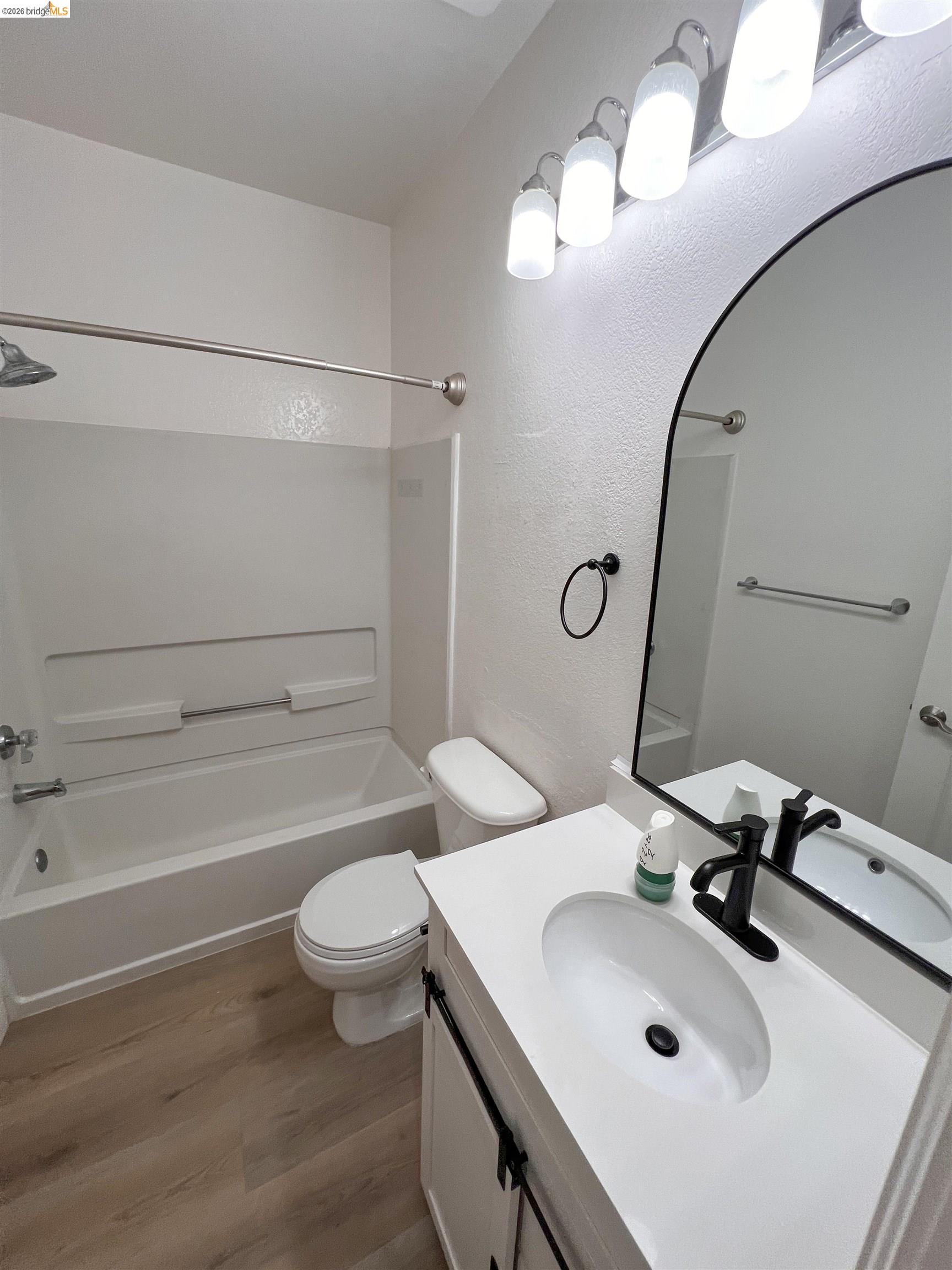 450 Pine Ridge Drive San Ramon, CA 94582 - Photo 7 of 18 a bathroom with a sink a toilet and a mirror