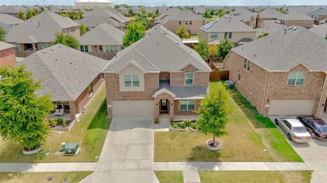 an aerial view of a house with swimming pool