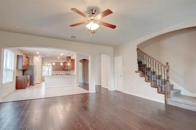 a view of an entryway and wooden floor