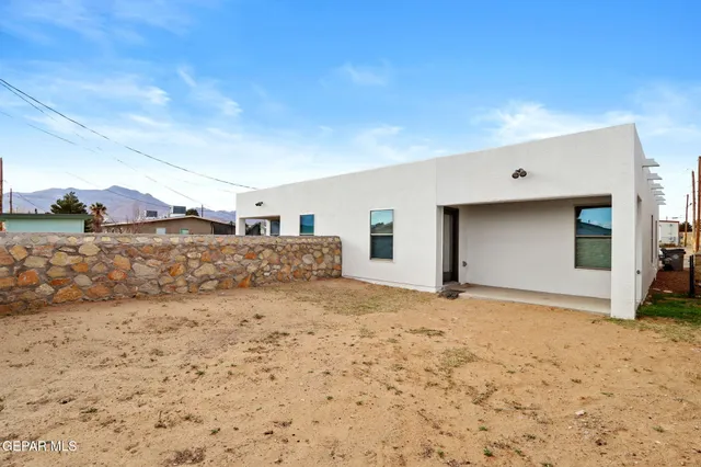 a view of a house with a dirt road