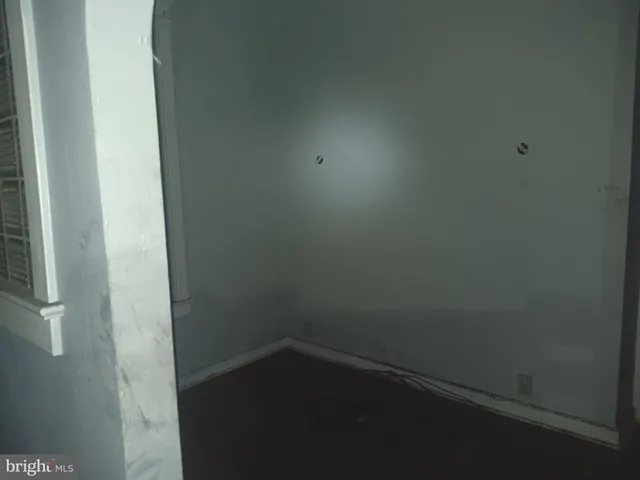 a view of a livingroom with bed