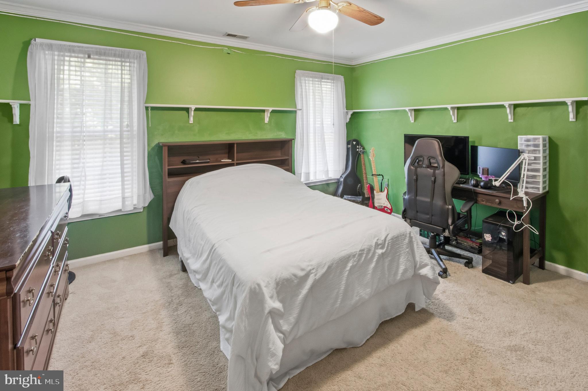 15 Hollybrook Road Mullica Hill, NJ 08062 - Photo 23 of 38 a bed sitting in a bedroom next to a window