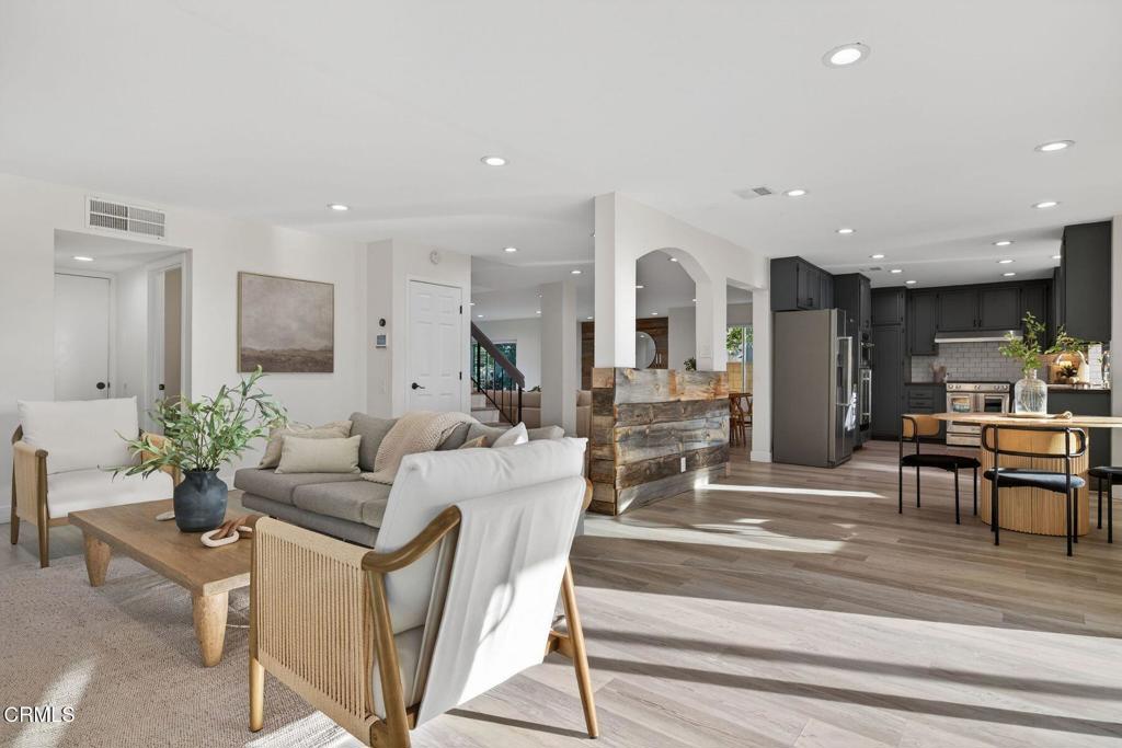 4975 North Buttercreek Road Moorpark, CA 93021 - Photo 19 of 47 a living room with fireplace furniture and a potted plant