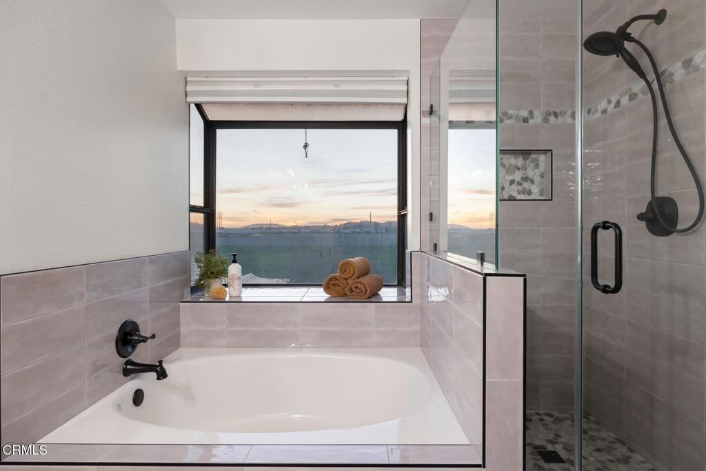 4975 North Buttercreek Road Moorpark, CA 93021 - Photo 27 of 47 a bathroom with a tub and shower