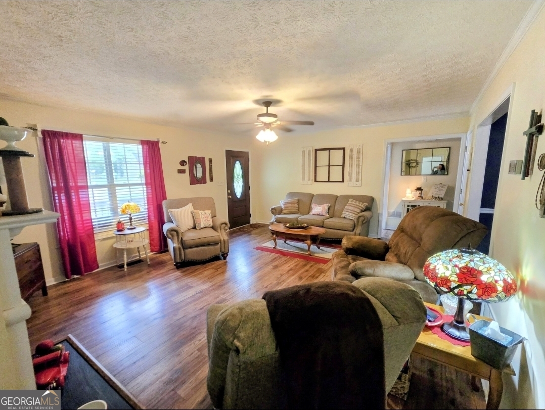 21 Baskin Heights Path Temple, GA 30179 - Photo 13 of 44 a bedroom with furniture and a chandelier