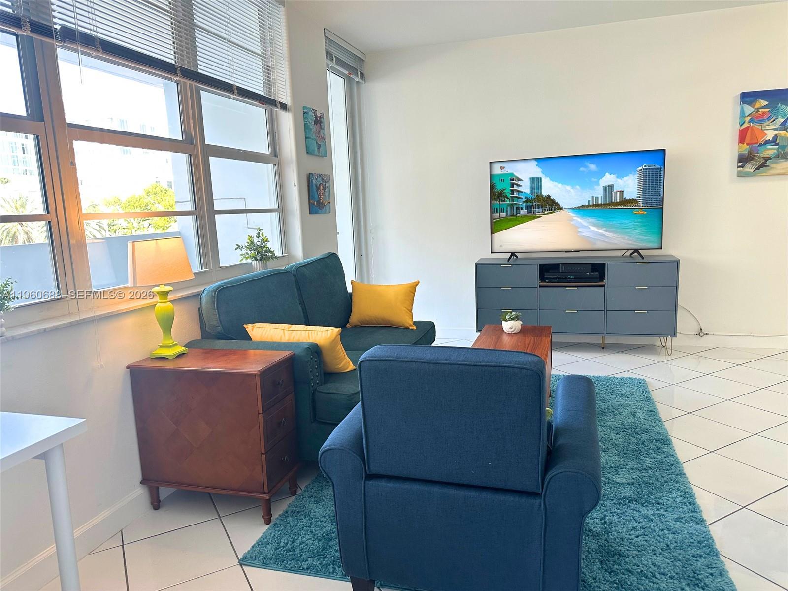 a living room with furniture and a window