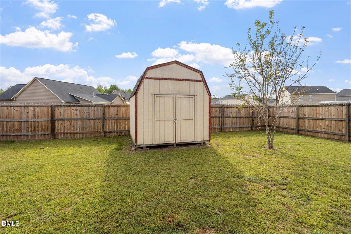 205 Battery Way Bunnlevel, NC 28323 - Photo 4 of 37 a view of a backyard