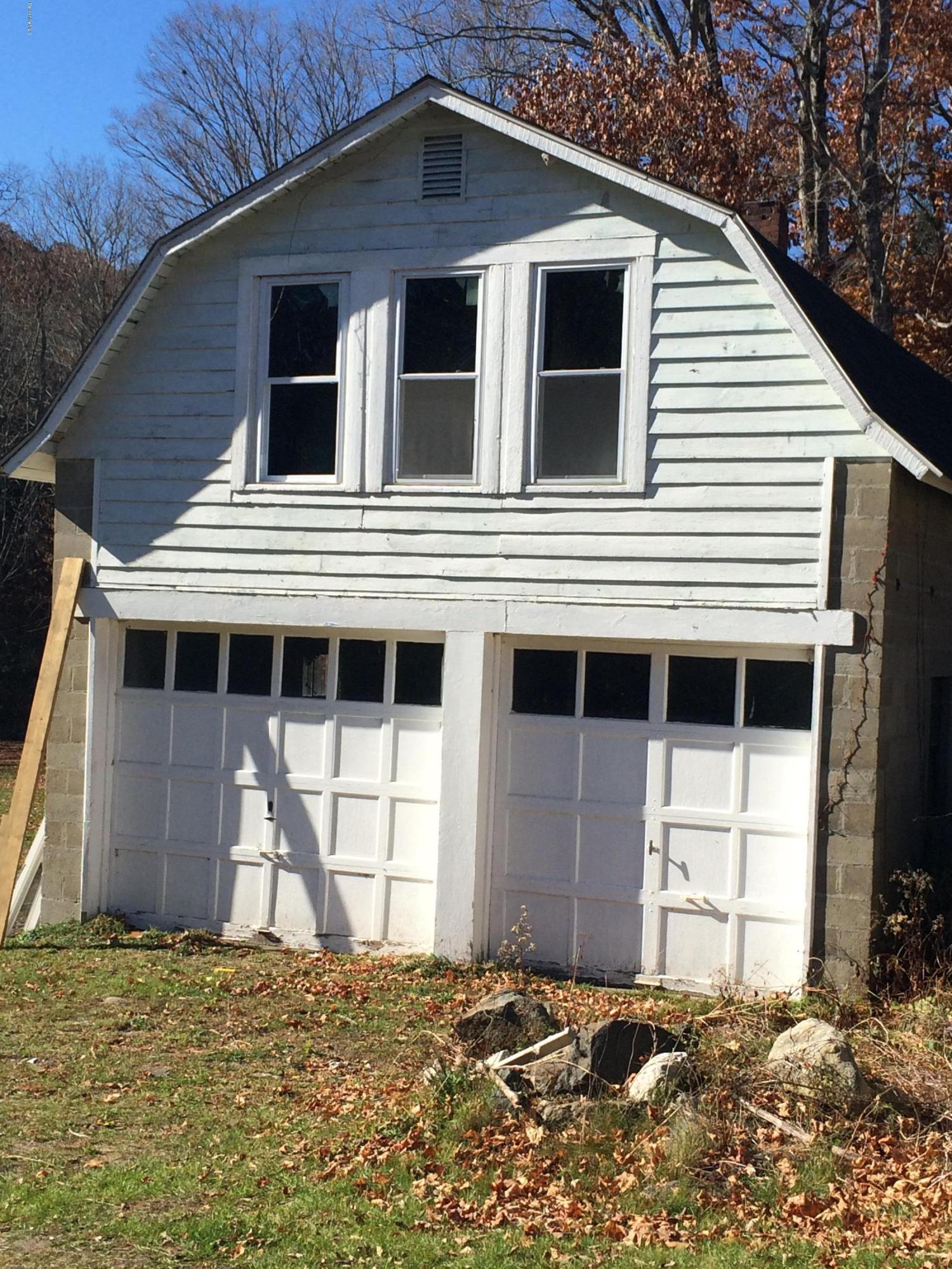 124 Sandisfield Road Sandisfield, MA 01255 - Photo 14 of 15 a house with a window