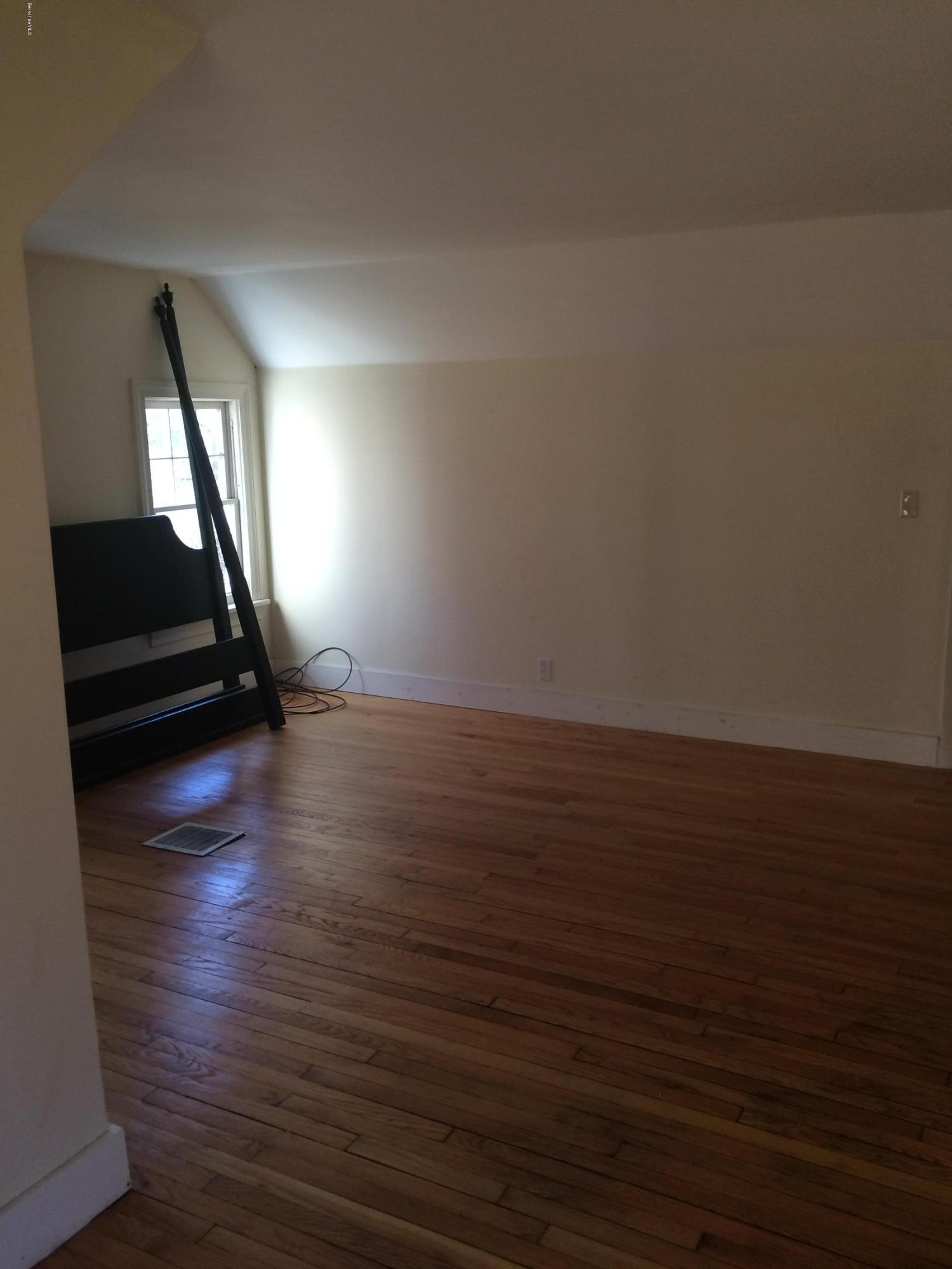124 Sandisfield Road Sandisfield, MA 01255 - Photo 4 of 15 a view of room with wooden floor and window