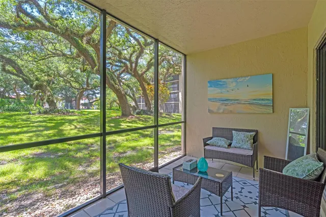 a view of a park with large trees