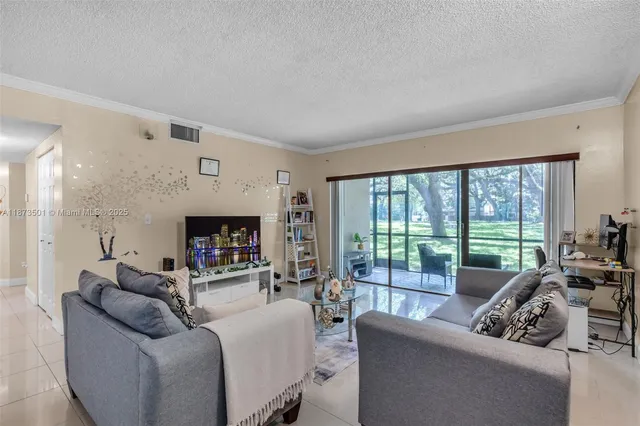 a bedroom with a bed and a television