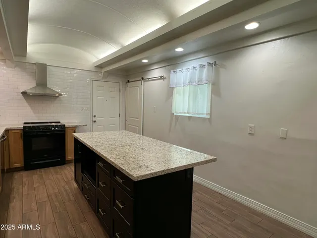 a kitchen with a stove and a sink