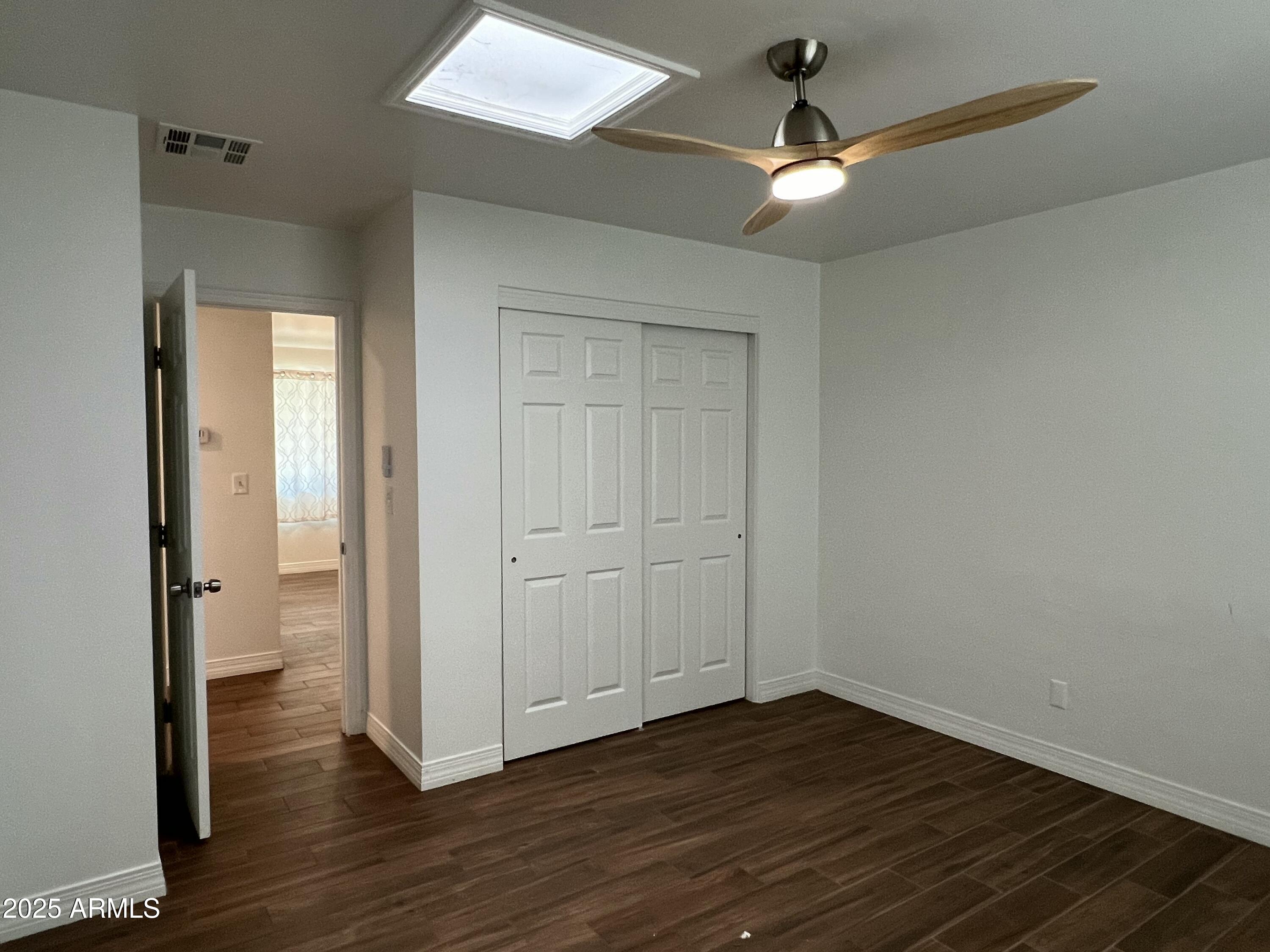 6202 North 14th Street, Unit 3/4 Phoenix, AZ 85014 - Photo 23 of 35 wooden floor in an empty room with a window