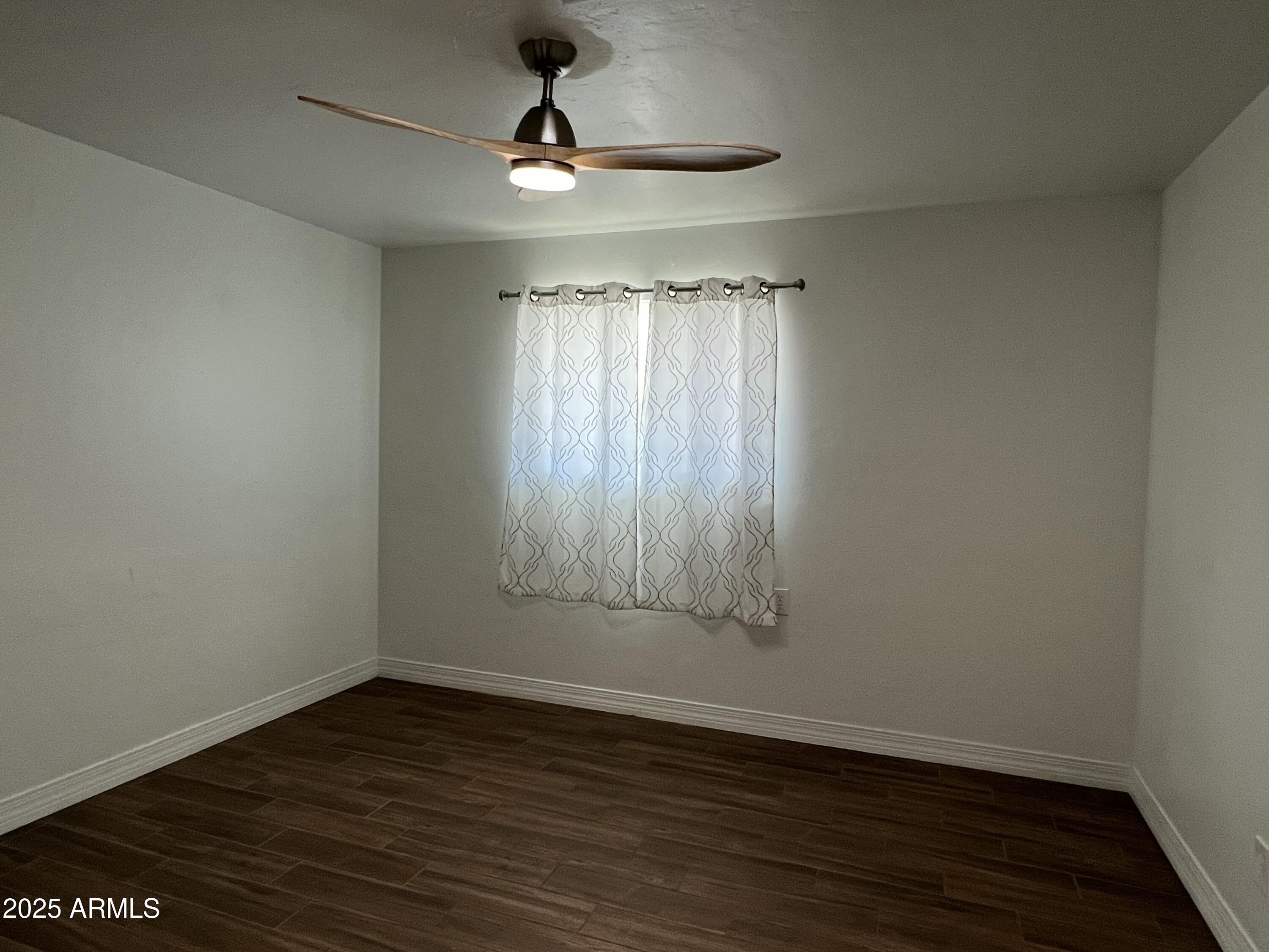 6202 North 14th Street, Unit 3/4 Phoenix, AZ 85014 - Photo 25 of 35 wooden floor in an empty room with a window