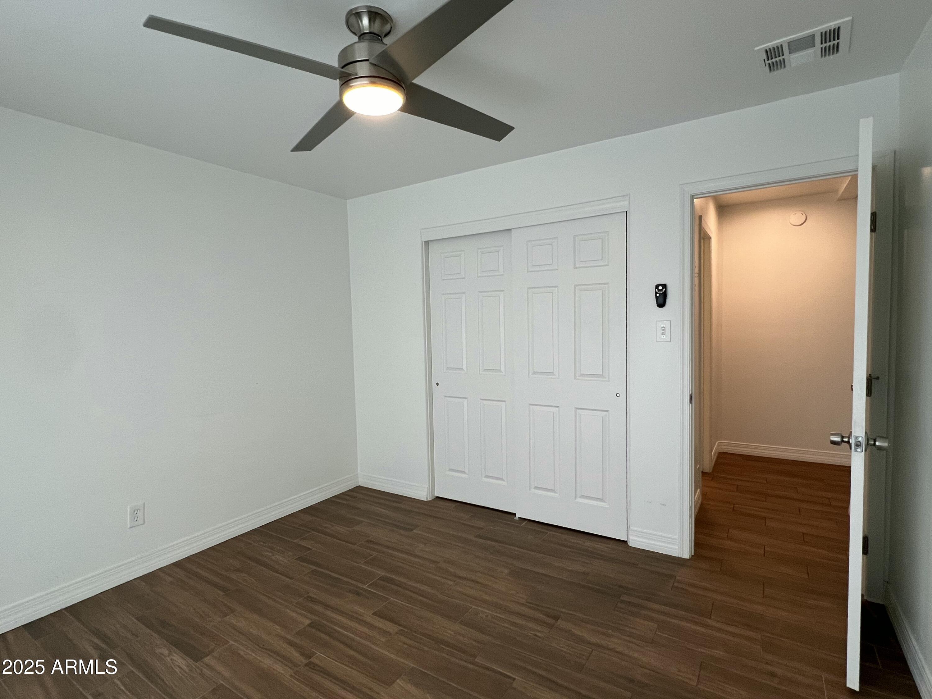 6202 North 14th Street, Unit 3/4 Phoenix, AZ 85014 - Photo 29 of 35 wooden floor in an empty room