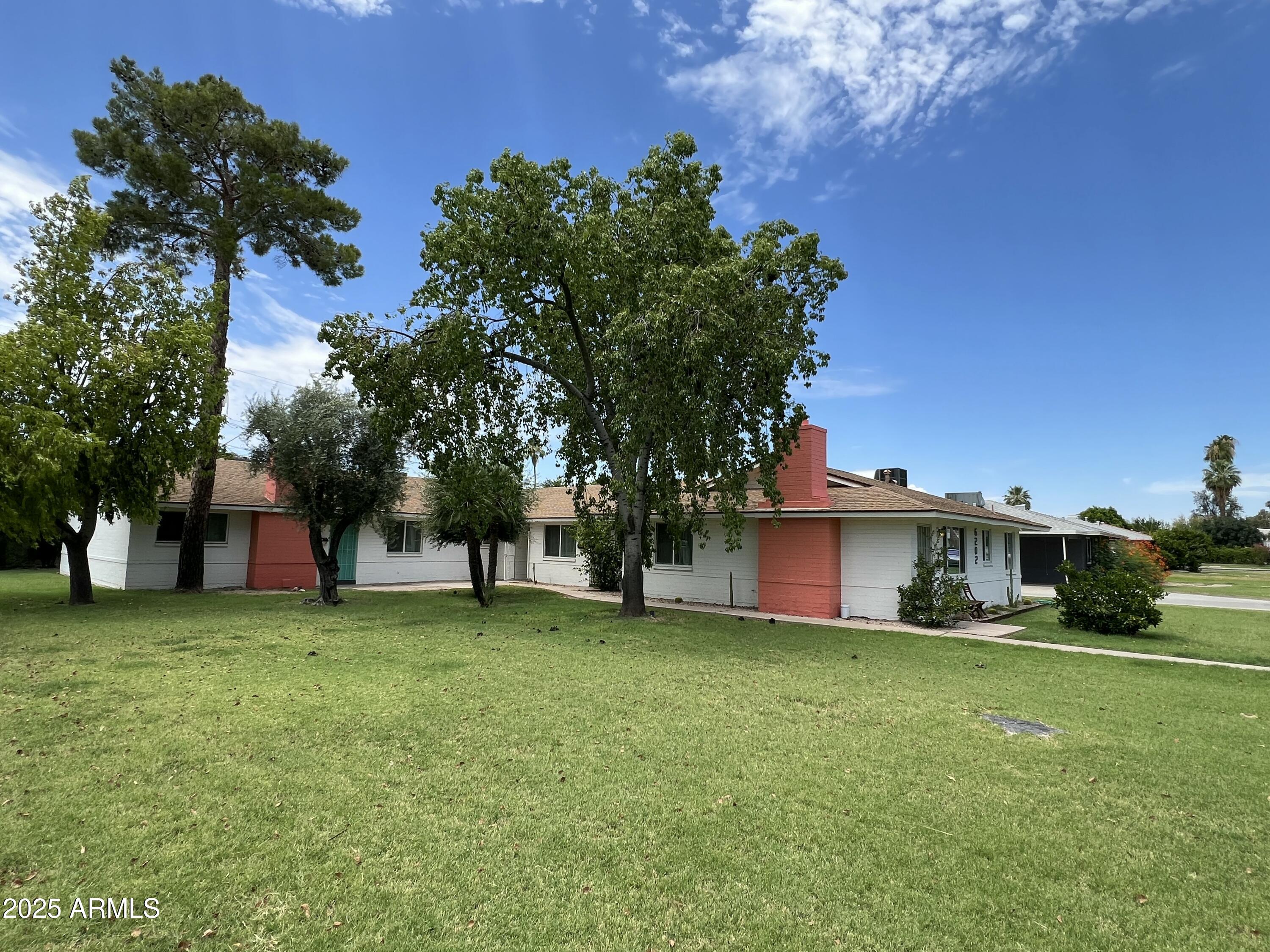 6202 North 14th Street, Unit 3/4 Phoenix, AZ 85014 - Photo 35 of 35 a view of a house with a yard