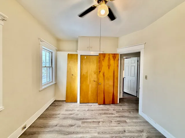 a view of entryway with wooden floor