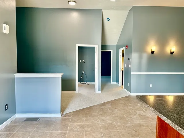 a view of a hallway with an empty room