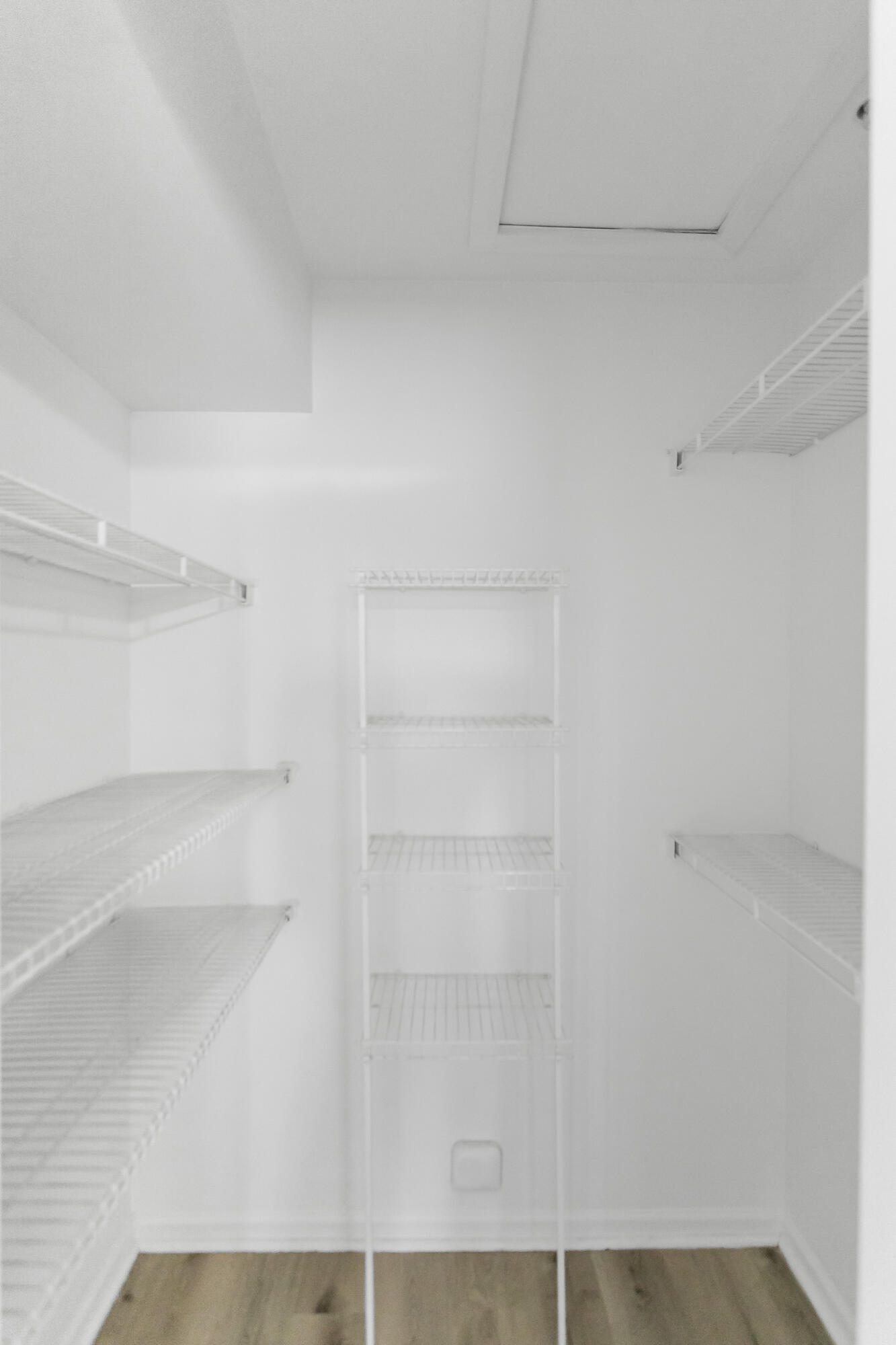 2113 Renaissance Boulevard, Unit 306 Miramar, FL 33025 - Photo 26 of 59 a view of walk in closet with empty racks
