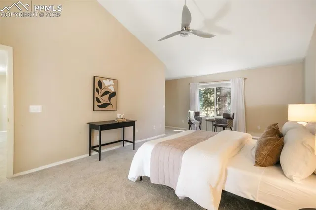 a bedroom with a bed and a table