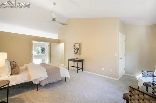 a spacious bedroom with a bed and window