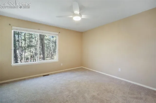 a bathroom with a granite countertop sink a toilet and a mirror