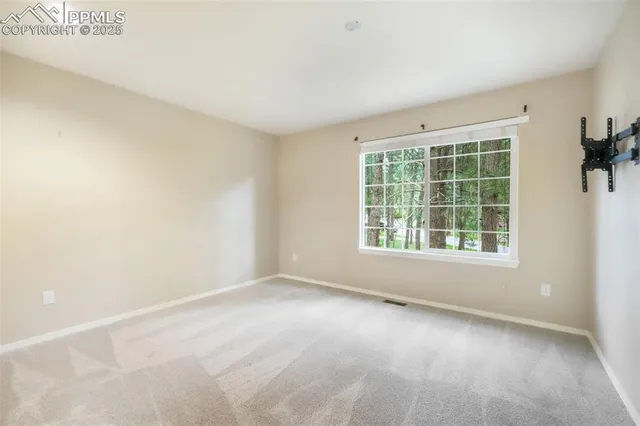 a view of a room with a sink and a mirror
