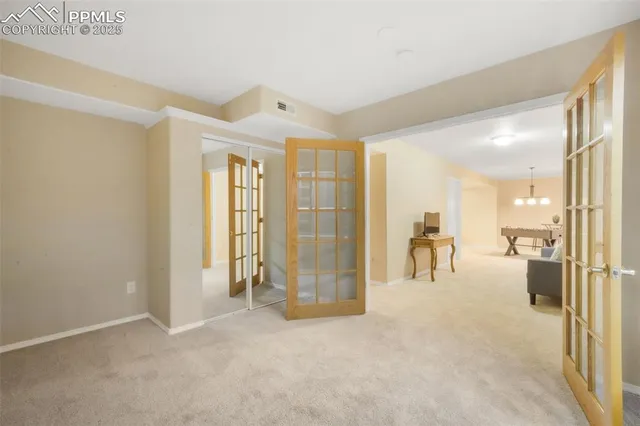 a view of a livingroom with a flat screen tv and outdoor space