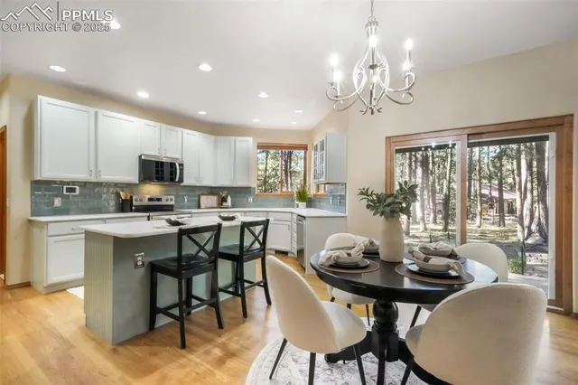 a view of a dining room with furniture window and outside view