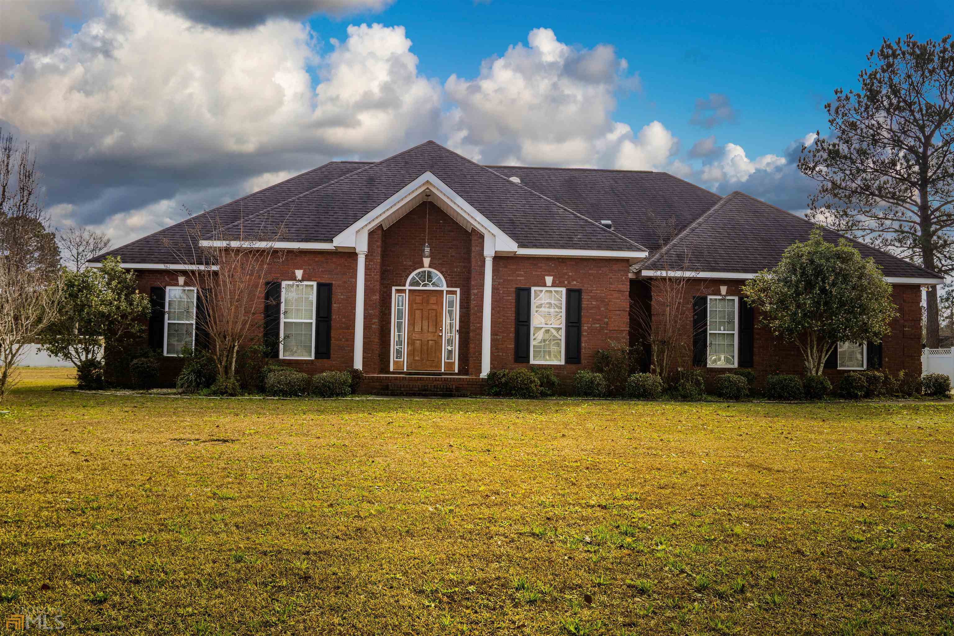 111 Hedge Way Dublin, GA 31021 - Photo 1 of 1 a view of a house with pool and brick wall