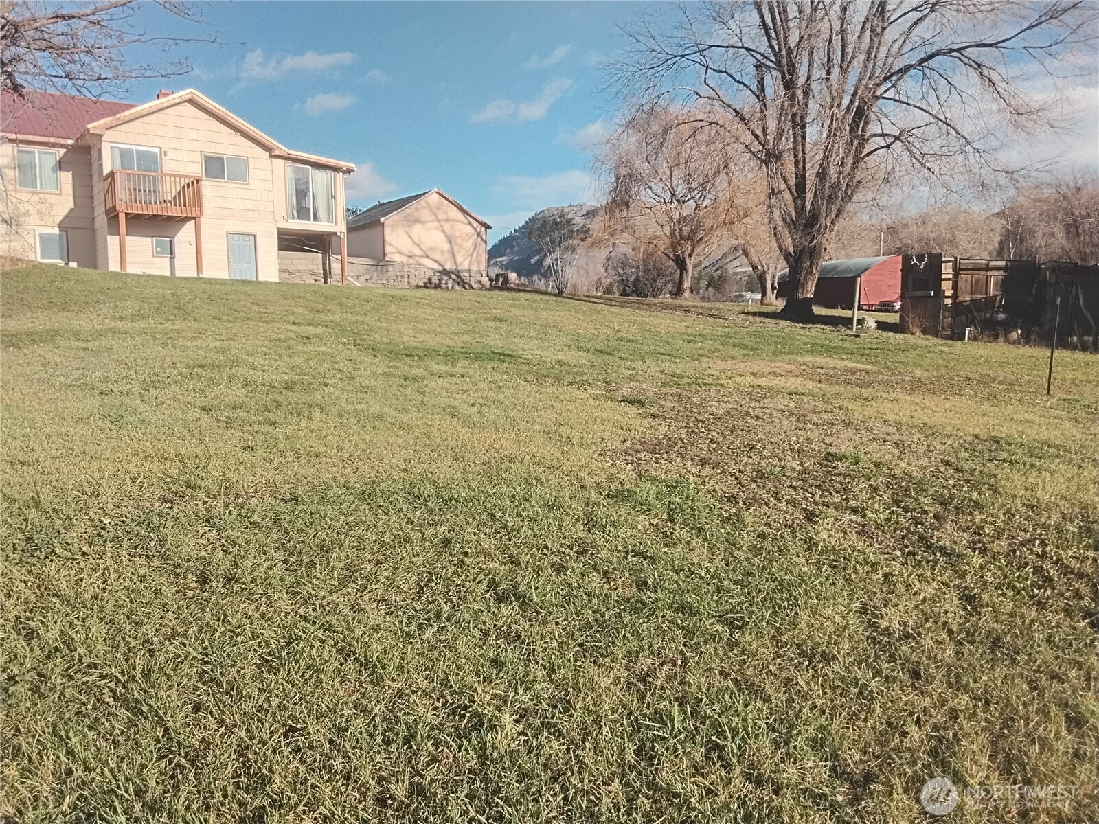 30 River Loop Road Tonasket, WA 98855 - Photo 1 of 37 a big yard with large trees