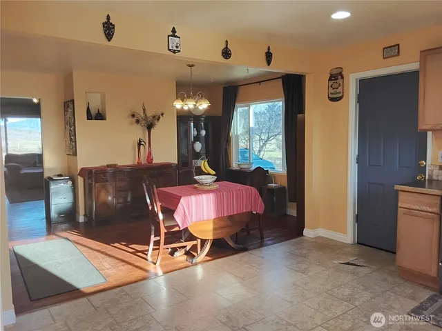 a dining room with furniture and window