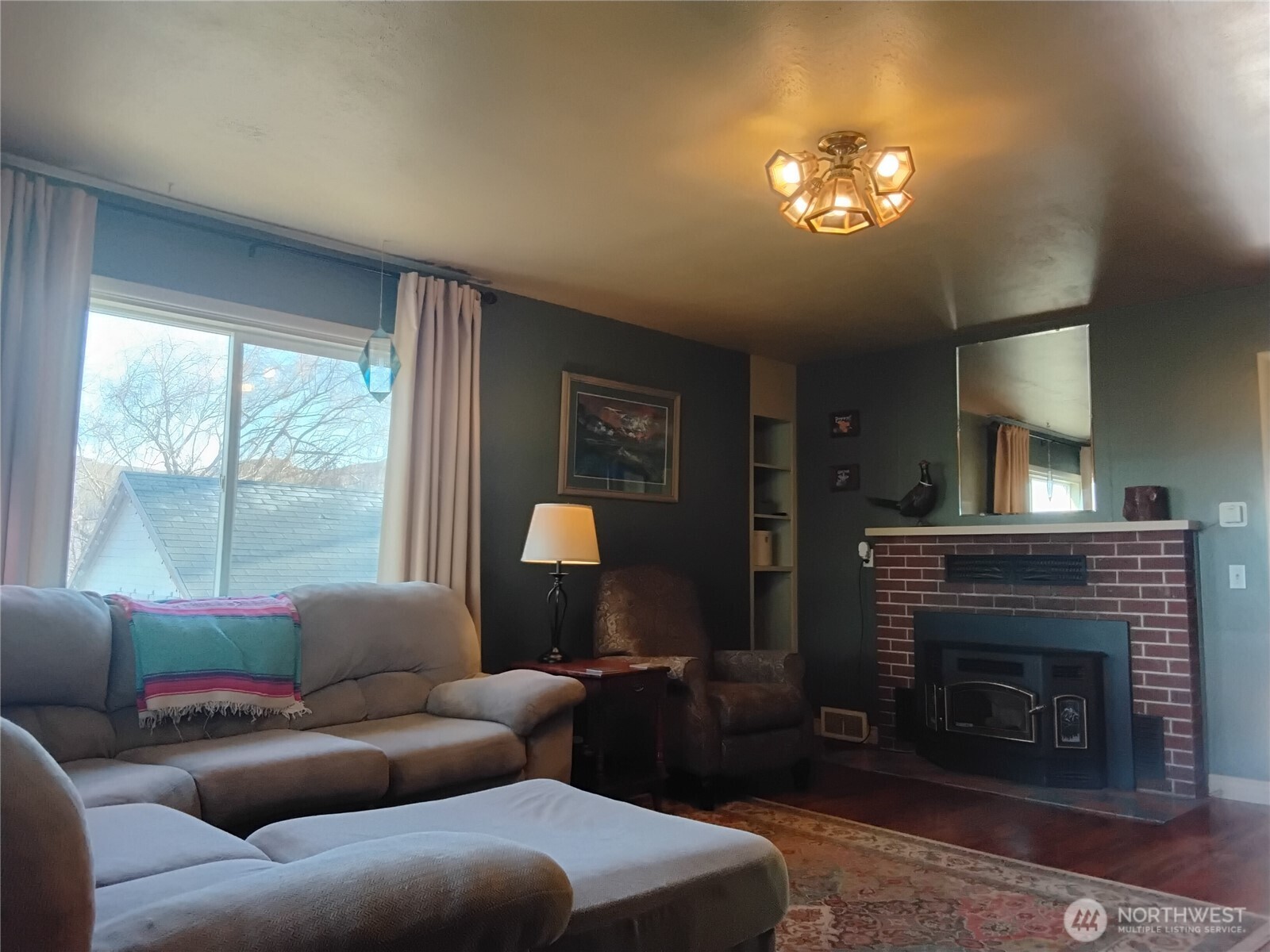 30 River Loop Road Tonasket, WA 98855 - Photo 17 of 37 a living room with furniture and a fireplace