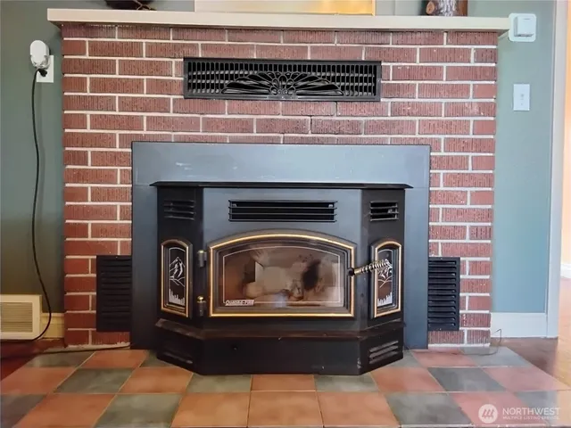 a stove top oven sitting inside of a kitchen