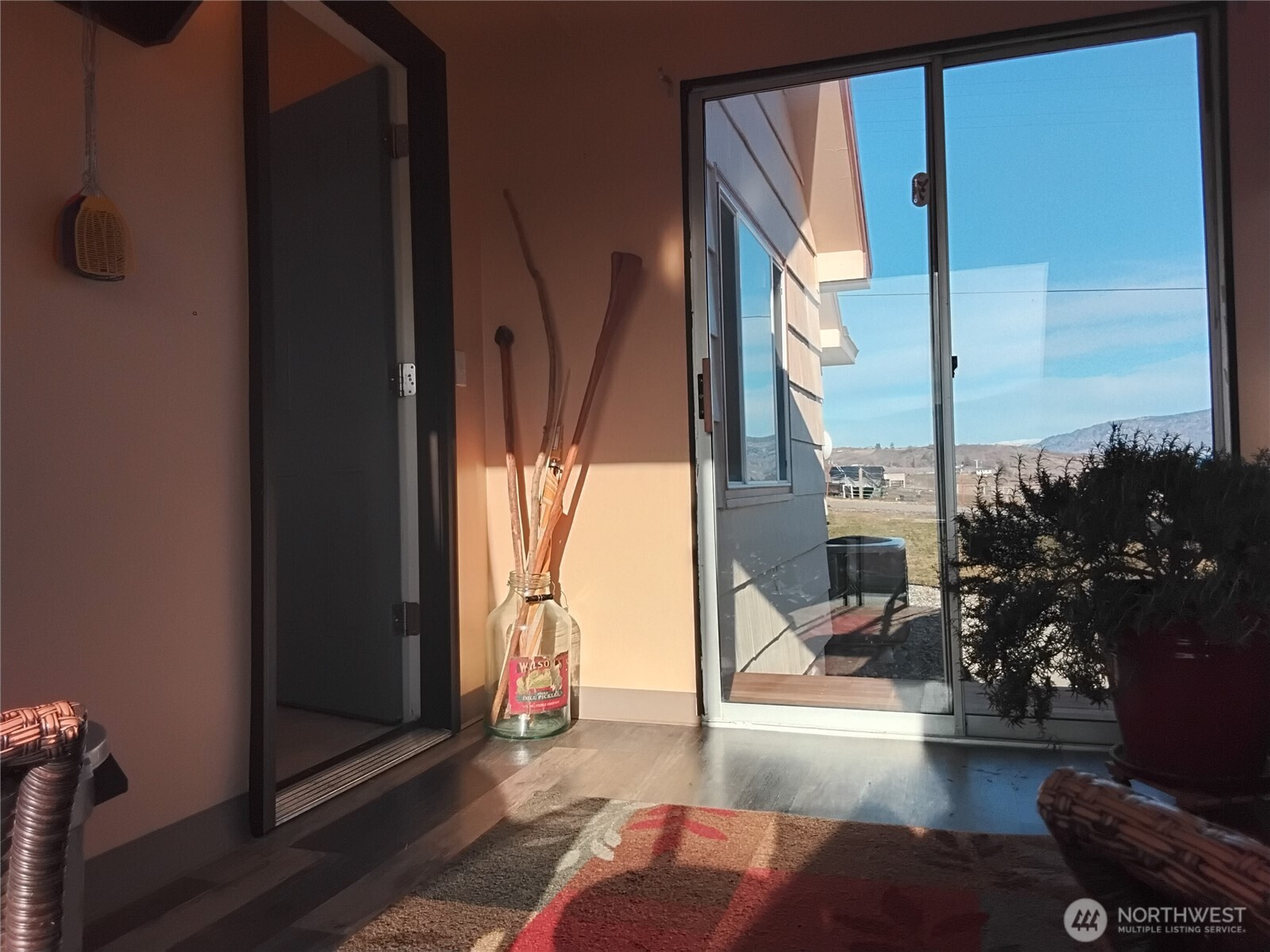 30 River Loop Road Tonasket, WA 98855 - Photo 22 of 37 a view of living room filled with furniture and a potted plant