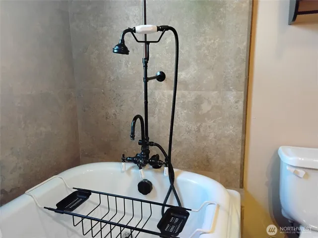 a bathroom with a sink a toilet and a shower