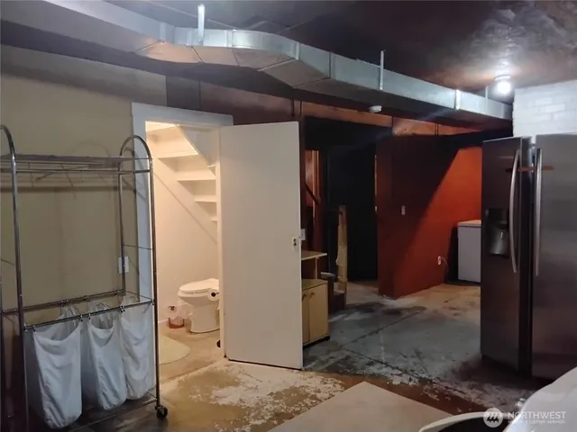 a bathroom with a shower and a sink