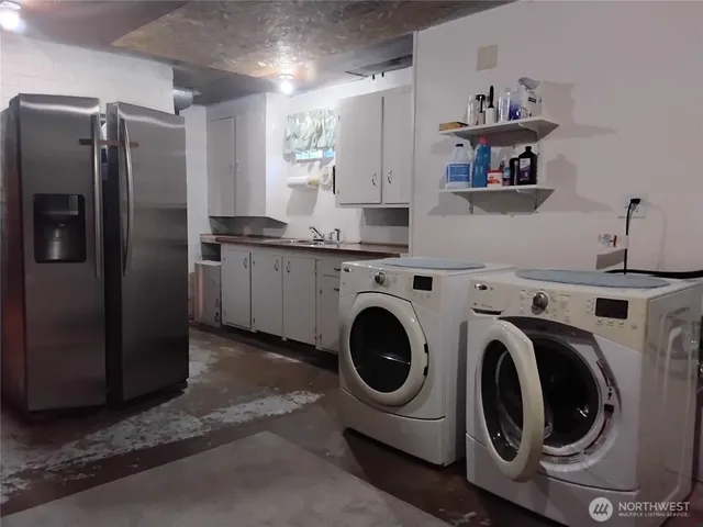 a bedroom with a bed and a lamp