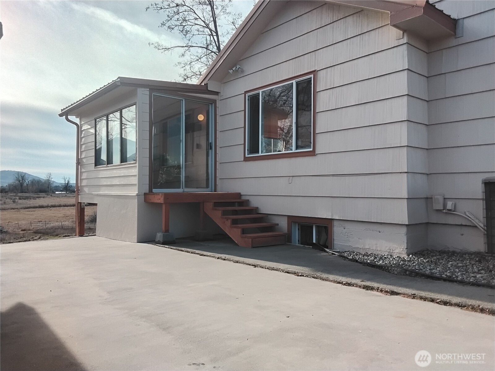 30 River Loop Road Tonasket, WA 98855 - Photo 4 of 37 a front view of a house with a yard
