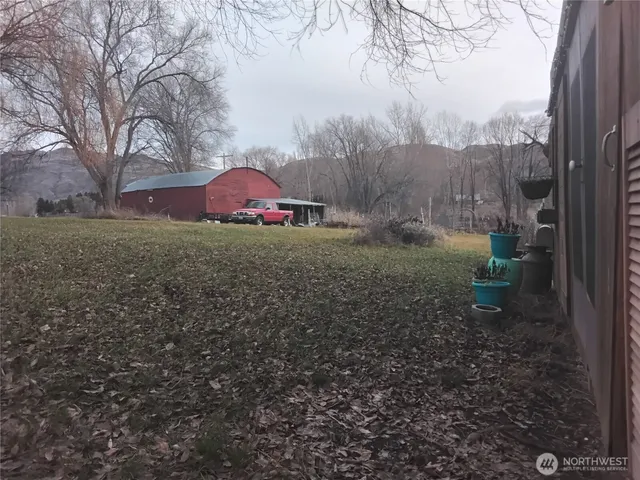 a backyard of a house with lots of green space