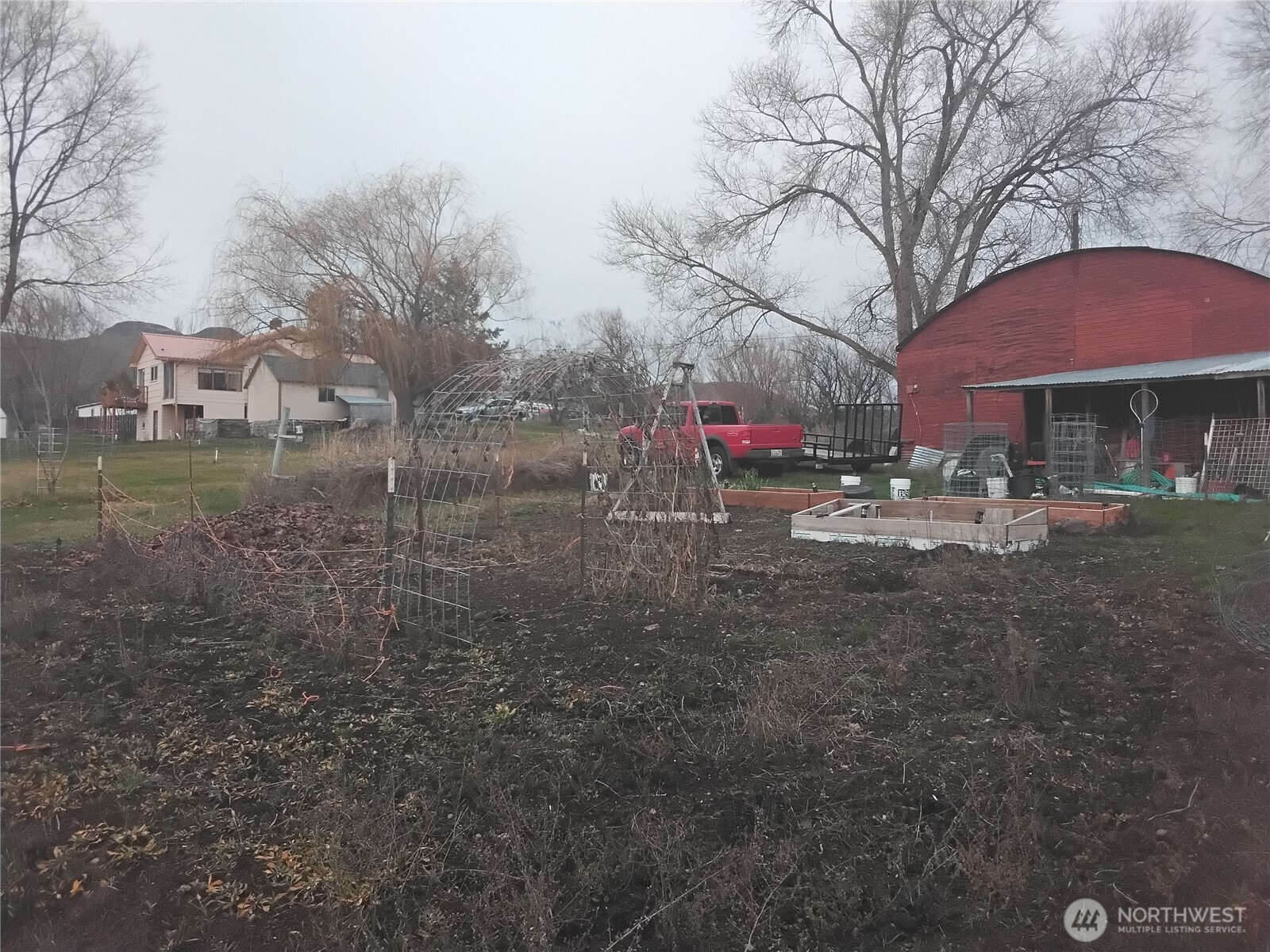 30 River Loop Road Tonasket, WA 98855 - Photo 8 of 37 a view of a house with a yard