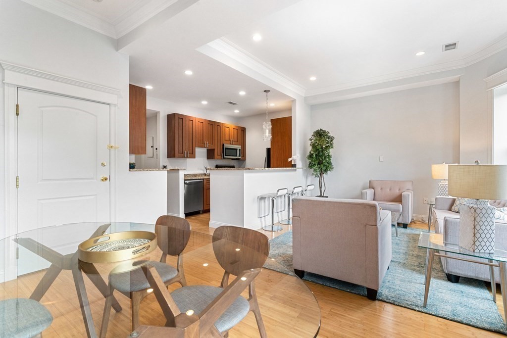 16 Worcester Square, Unit 3 Boston, MA 02118 - Photo 3 of 18 a view of a dining room with furniture and wooden floor