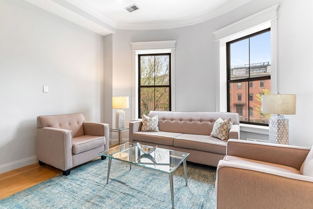 16 Worcester Square, Unit 3 Boston, MA 02118 - Photo 4 of 18 a living room with furniture and a window