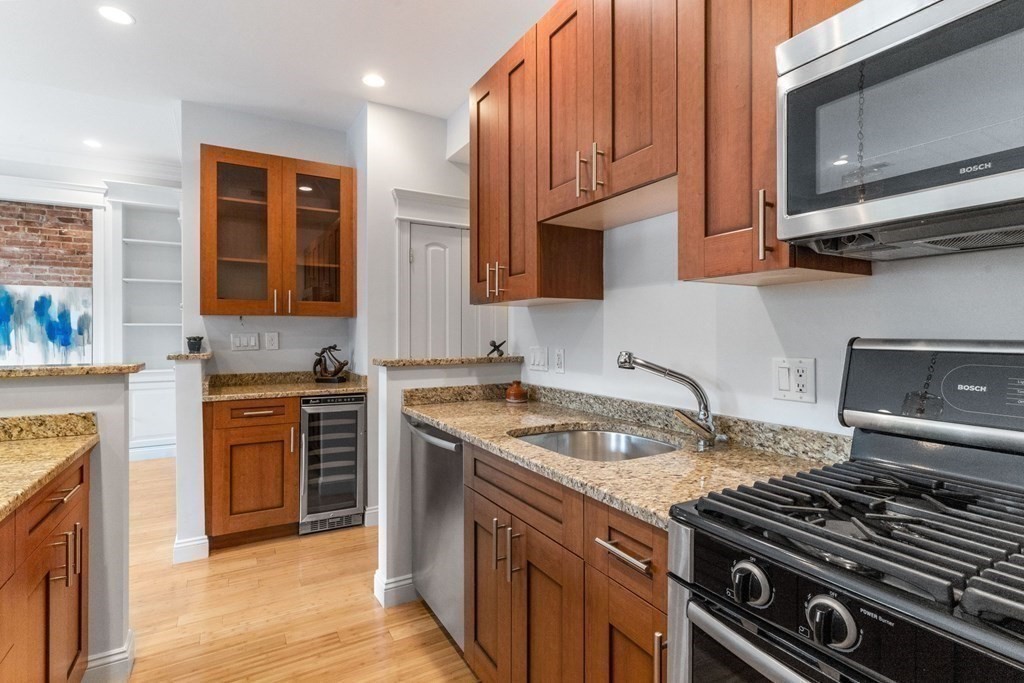 16 Worcester Square, Unit 3 Boston, MA 02118 - Photo 7 of 18 a kitchen with stainless steel appliances granite countertop a stove and a sink