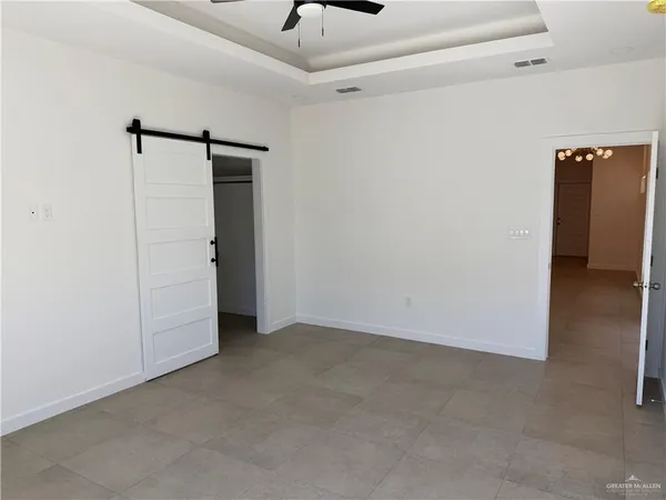 a view of hallway with wooden floor