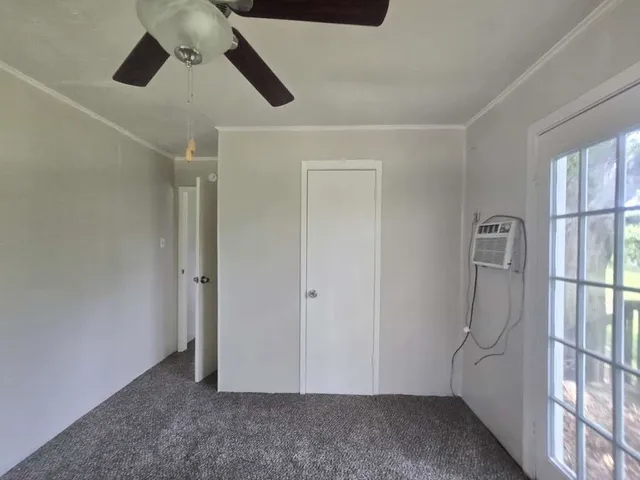 a view of room with air conditioner and window