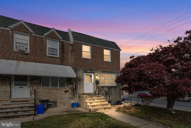 a front view of a house with garage