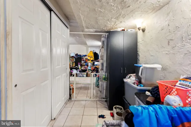a kitchen with a refrigerator a stove and a sink