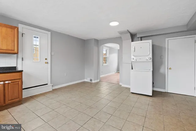 a view of a kitchen with refrigerator and cabinet