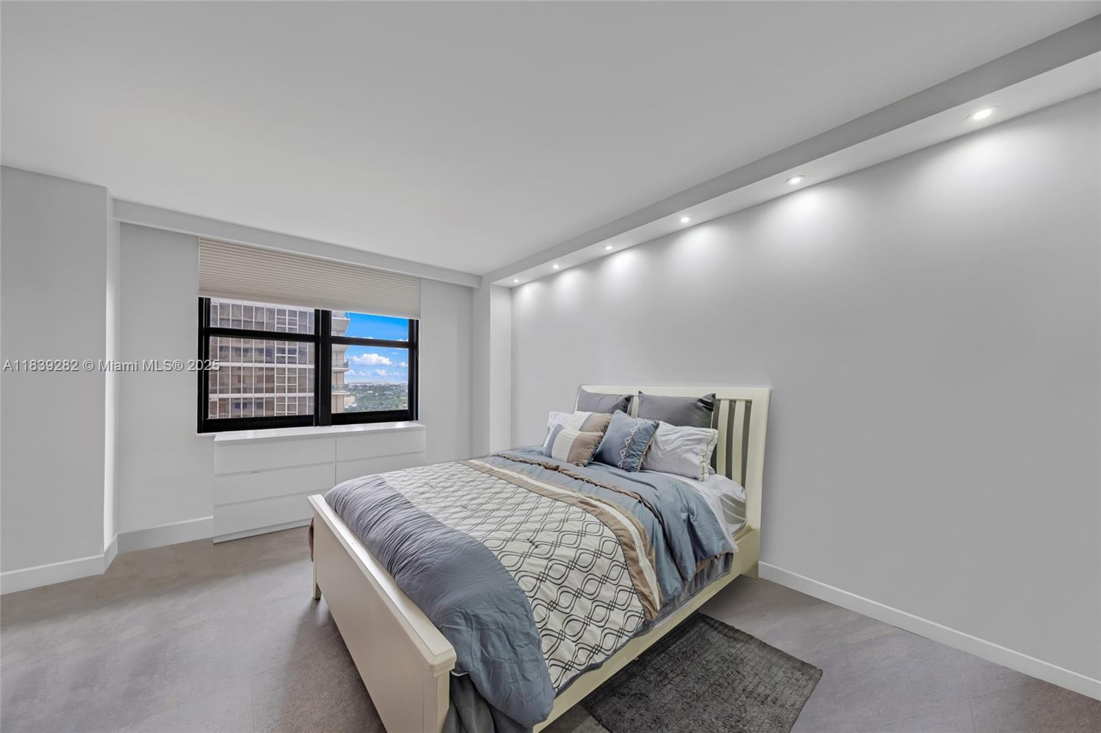 9801 Collins Avenue, Unit 16U Bal Harbour, FL 33154 - Photo 19 of 33 a bedroom with a bed and wall painting